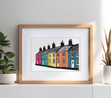 Scene of brightly coloured welsh cottages in a terrace row